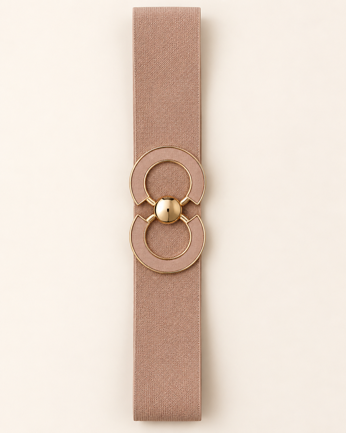 Ceinture ORIANE rose poudré, bande élastique et boucle double cercle à contours dorés, vue à plat sur fond beige.