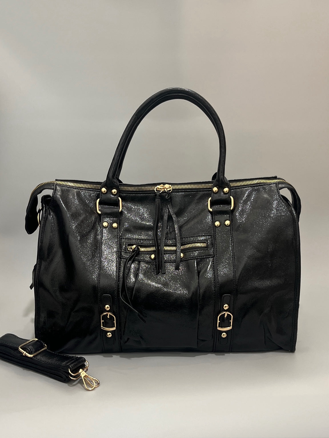 Sac grand format noir brillant avec détails dorés